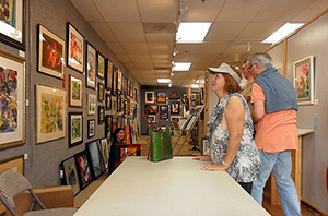 Visitors viewing COAL artworks